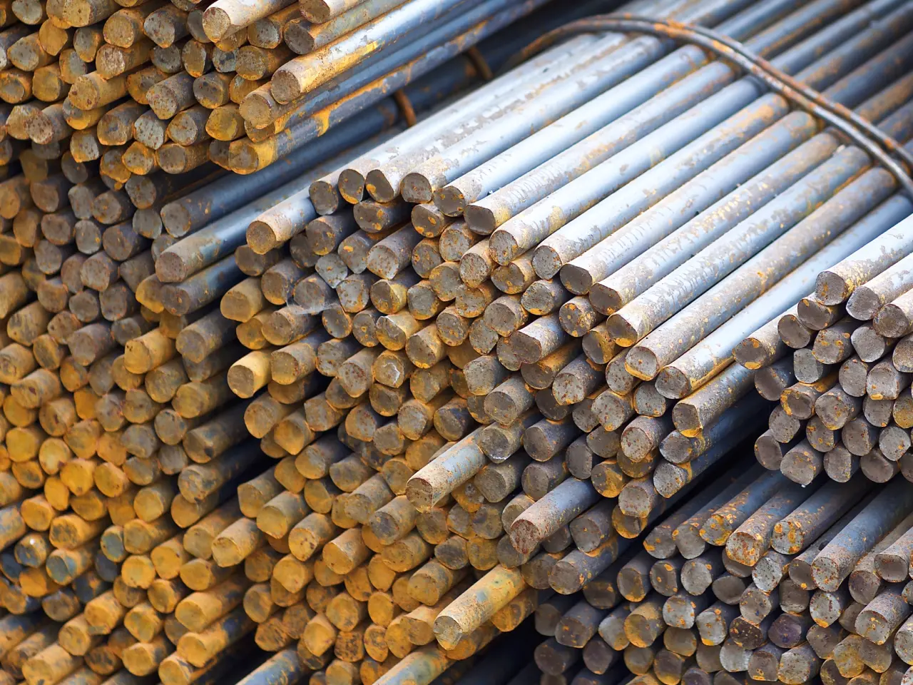 Stacked metal rods in a bundle.